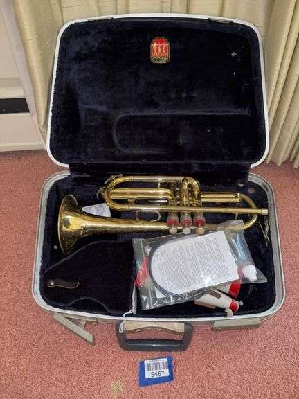 Conn Cornet with two straight mutes, cleaning kit, and case
