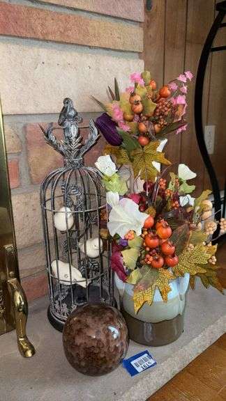 Decorative birdcage, floral arrangements, ceramic orb