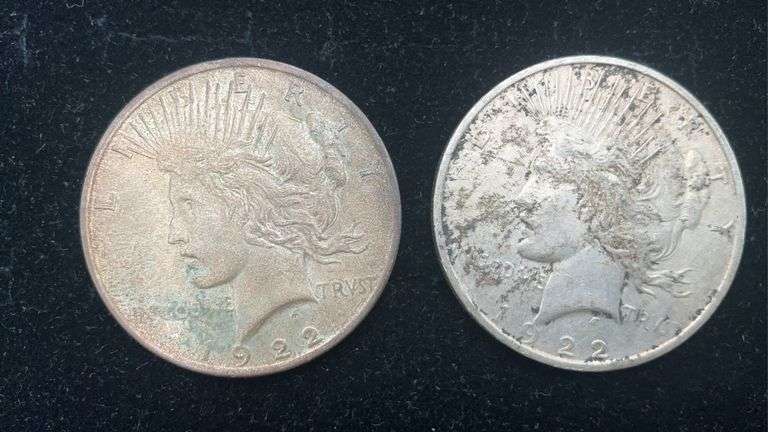 Two 1922 Peace silver dollar coins - by the pc take two