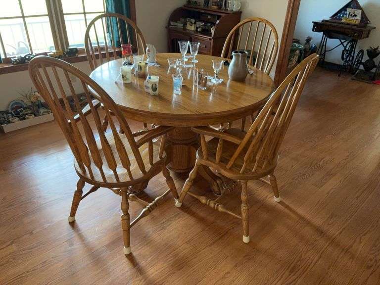 Round oak pedestal dining table and set of four Windsor chairs - no contents 48x48x30 - MUST COME DURING LAST 2 HOURS OF PICKUP FOR THIS ITEM