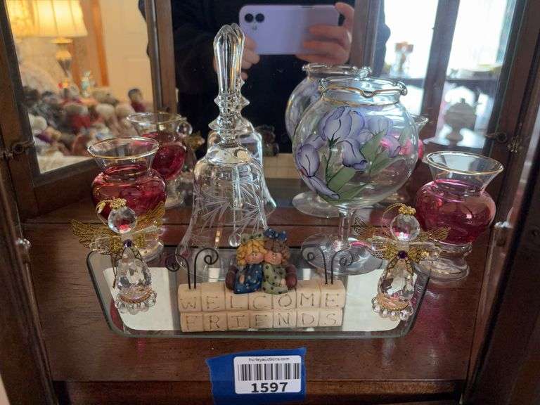 Contents of shelf: glass bell, decorated vases, angel ornaments, Welcome Friends figurine