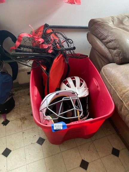 Tote of sporting goods and digital blood pressure monitor