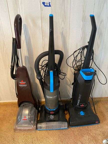 Three Bissell upright vacuums