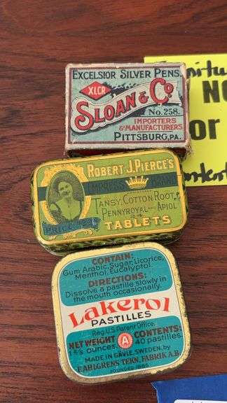 Two advertising tins and pen box