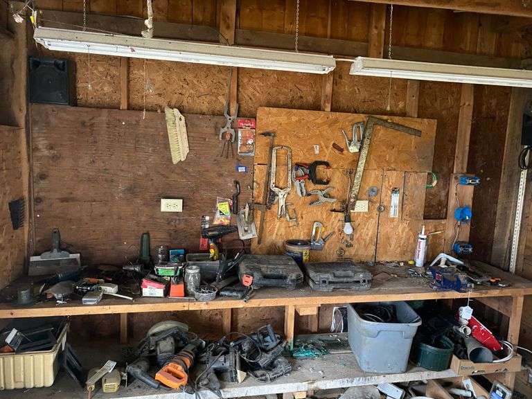 Contents of top shelf and on wall above: hand and power tools, hardware, misc