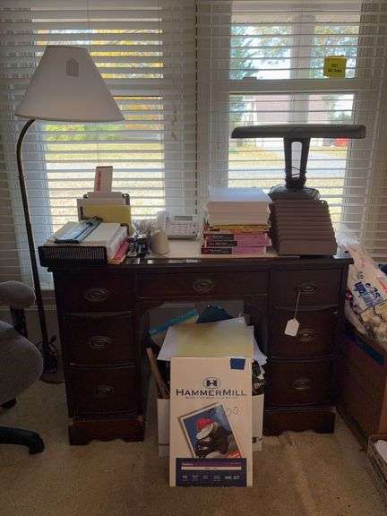 Floor lamp, kneehole desk and contents on and under: desk lamp, desk phone, office supplies, office paper 42x19x30
