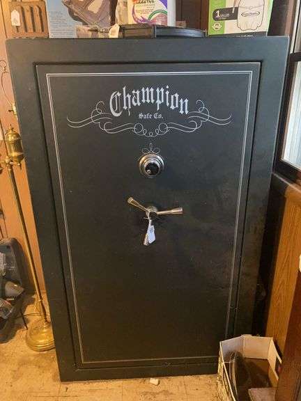 Champion gun safe w/ 39 gun slots 37x28x60 - combination will be provided