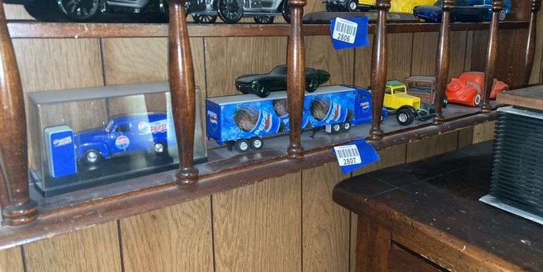 Contents of one what-not shelf - Pepsi machine & truck & misc others