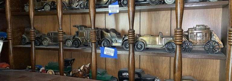 Contents of one what-not shelf - cast metal vehicle replicas, stage coach