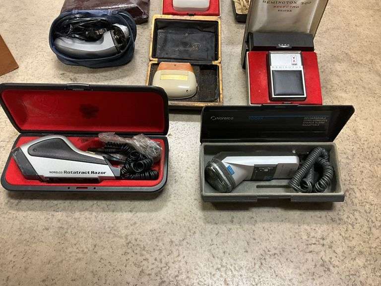 Vintage electric razors in cases - Hurley Real Estate & Auctions