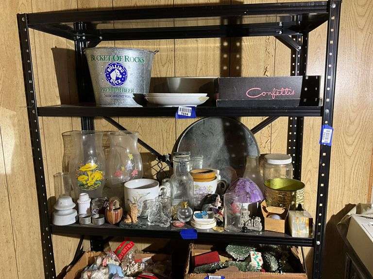 Contents of two shelves: food grinder, household and decor items