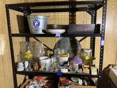 Contents of two shelves: food grinder, household and decor items