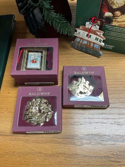 Two Howard Miller limited edition Santa figures in boxes, Baldwin brass Christmas ornaments, faux tree