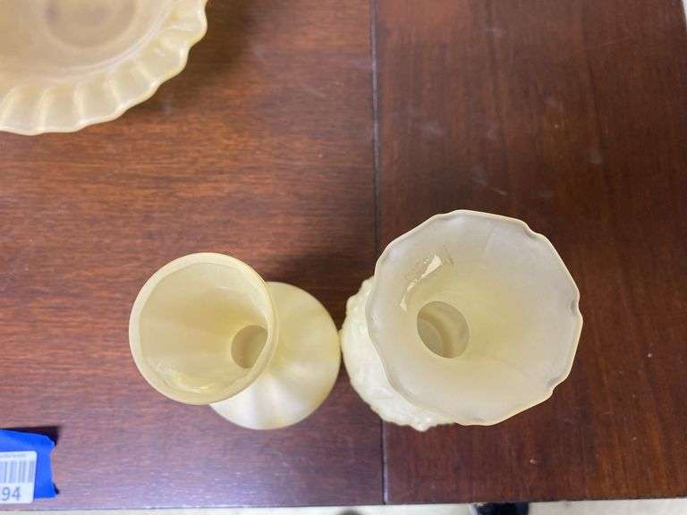 Two yellow satin glass bud vases