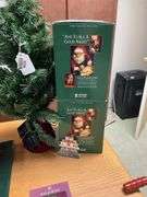 Two Howard Miller limited edition Santa figures in boxes, Baldwin brass Christmas ornaments, faux tree