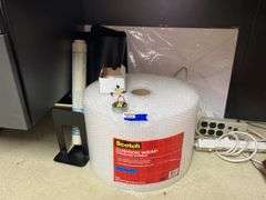 Roll of bubble wrap, power strips, misc