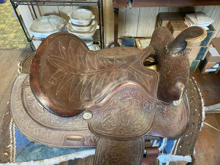 Fancy tooled leather saddle, saddle blanket,  and stand