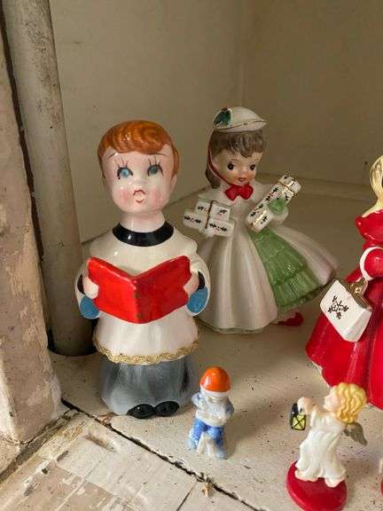 Contents of shelf: vintage china Santa and other Christmas figurines