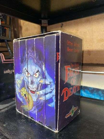 Contents of shelf: Faces of Death VHS box set, music CDs in case