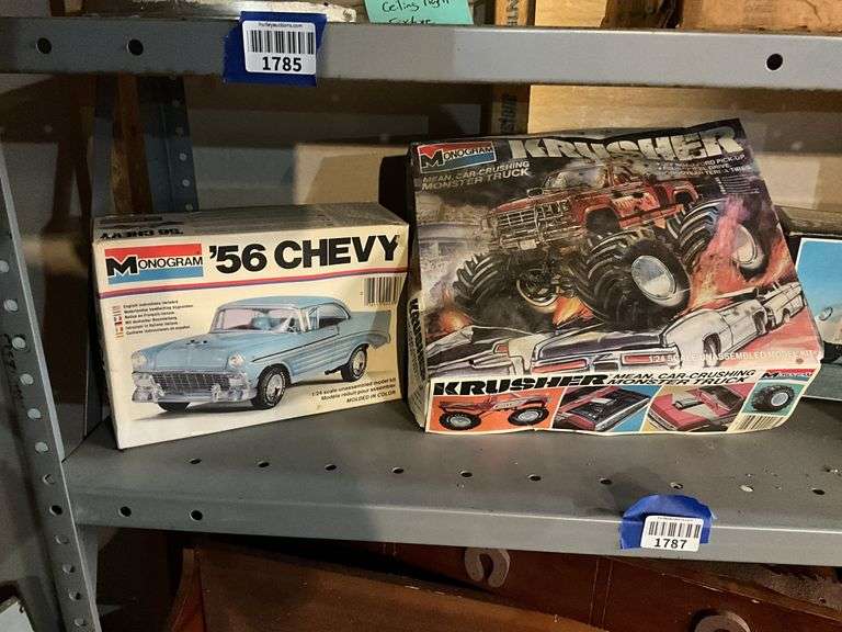 Contents of shelf: vintage car/truck model kits in boxes