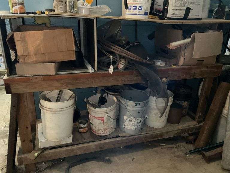 Workbench and contents: copper tubing, plumbing parts, misc