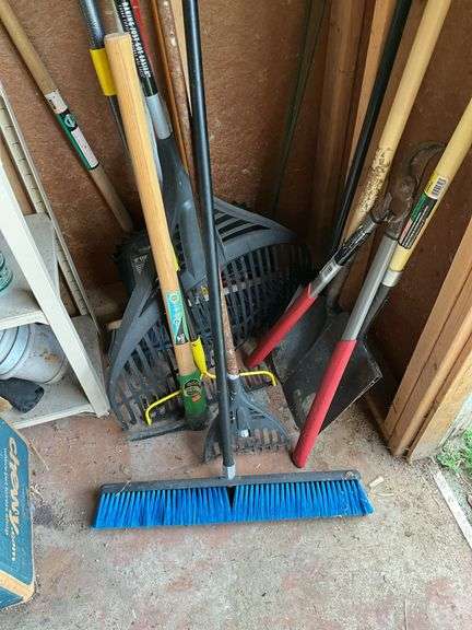 Corner lot: push broom, pick, rakes, lopper, shovel