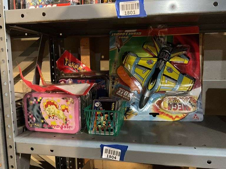 Pokeman cards and tins, Mega Looper stunt flyer in package
