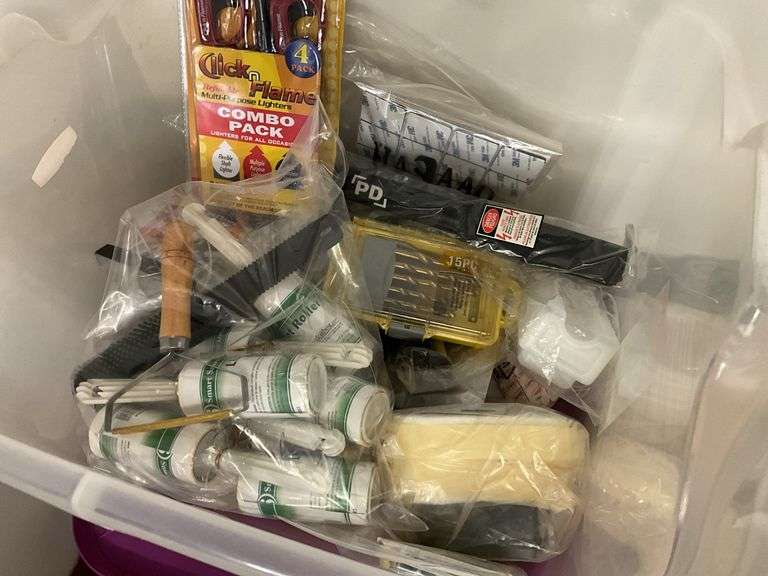 Contents of bathroom: iron, ironing board, rolling stand, waste basket, craft supplies, lightbubls