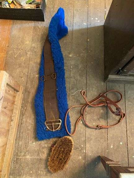 Horse tack in wooden crate