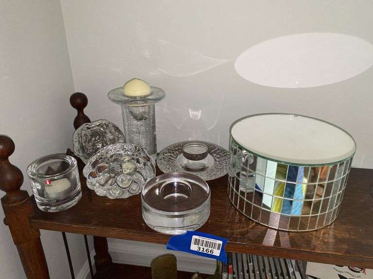 Glass votive holders, and mirrored display pedestal