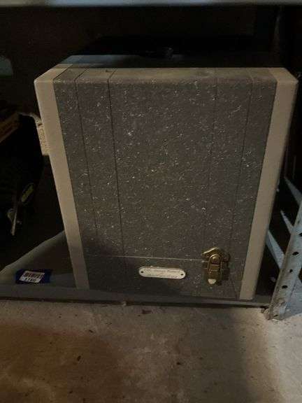 Contents of shelf: Wildfire WF1200 generator, vintage slide projector