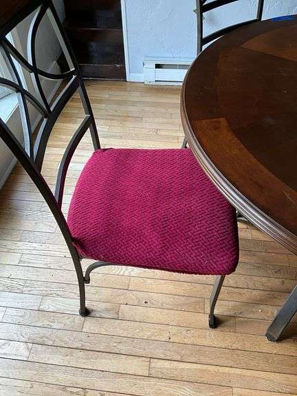 Wrought metal base table w/ round wooden top and set of four matching chairs w/ padded seats 44x44x30