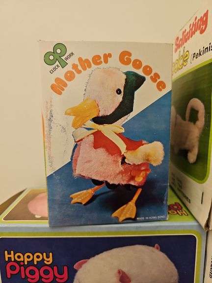 Wind-up and battery op toys in boxes including: Mother Goose, dog, pig, bears, calf