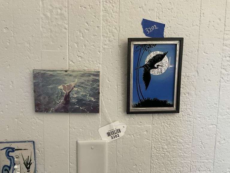 Dolphin tail photograph, and heron tinsel painting