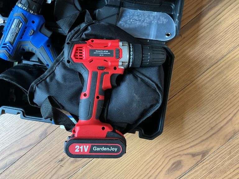 Cordless tool kit: two drills, mini chainsaw, charger