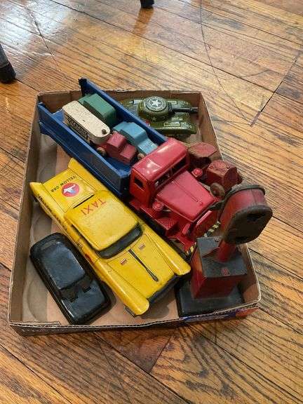 Toy lot including: litho tin Yellow Cab and tank, pressed steel truck, train signal, wooden trucks