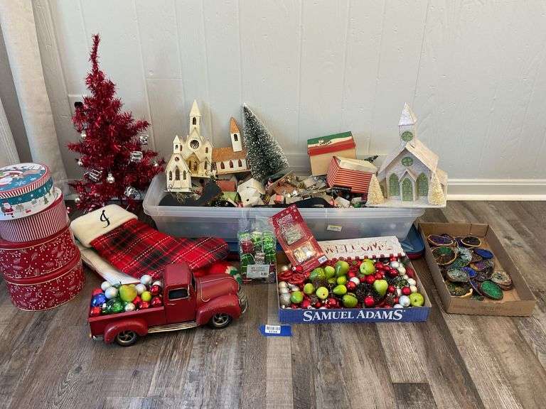 Christmas decor including some vintage: putz houses, red tree, ornaments, tins, model pickup truck