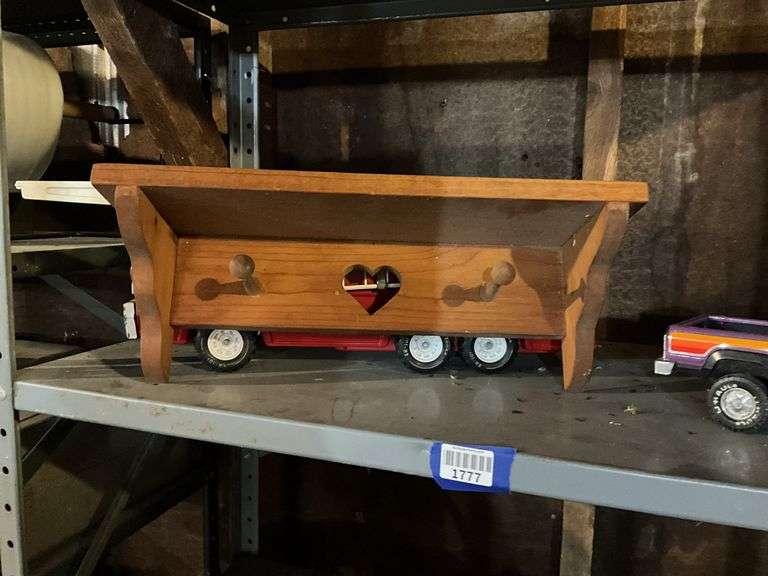 Wooden bracket shelves, metal horse cutouts