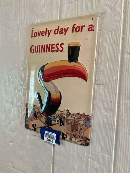 Guinness embossed tin advertising sign