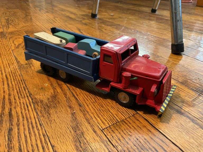 Toy lot including: litho tin Yellow Cab and tank, pressed steel truck, train signal, wooden trucks
