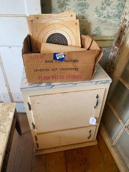 Base cabinet w/ formica top, NRA pistol targets, shot shells 20.5x17x28
