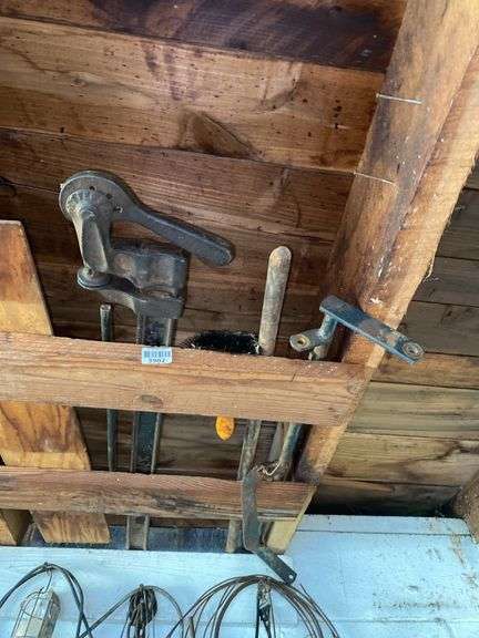 Assorted wood clamps in rafters - Hurley Real Estate & Auctions