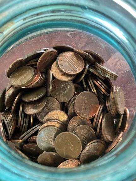 Blue canning jar of pennies
