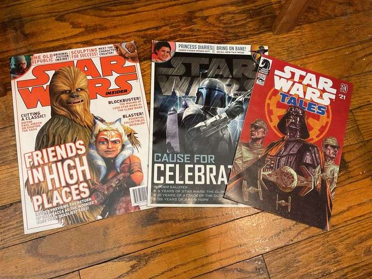 Star Wars collectibles including: VHS tapes, figures, CommTech reader, Darth Vader watch