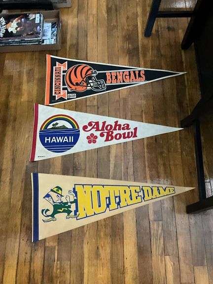 Six pennants: Buffalo Bills (autographed), Forty-Niners, Jets, Bengals, Notre dame, Aloha bowl