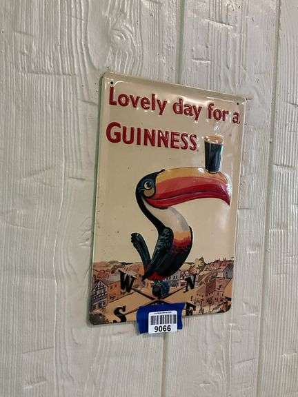 Guinness embossed tin advertising sign