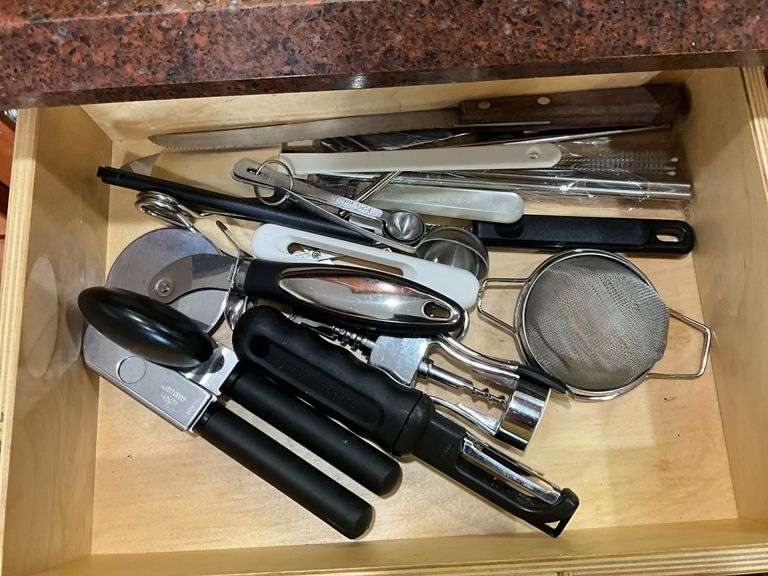 Contents of drawer: flatware, utensils