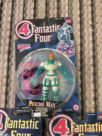 Three Fantastic Four action figures in packages