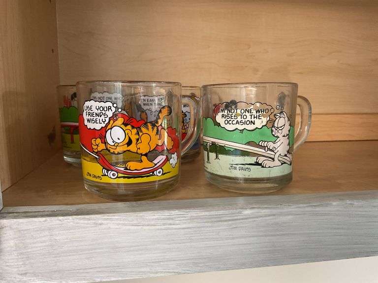 Four Garfield glass mugs