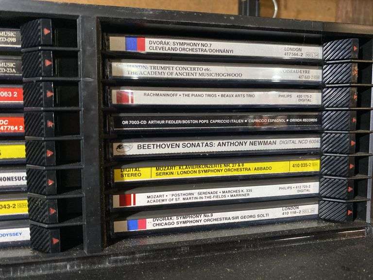 Contents of shelf: Faces of Death VHS box set, music CDs in case
